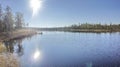 Forest Lake. The reflection of the sun on the water.